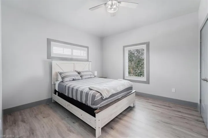 Bedroom featuring light wood-type flooring and ceiling fan