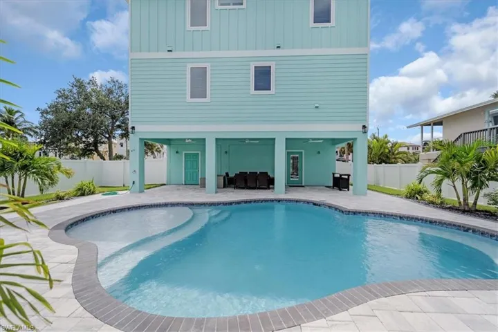 View of swimming pool with a patio area