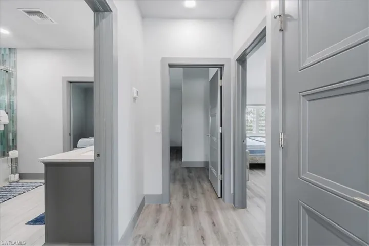 Hall with light hardwood / wood-style flooring