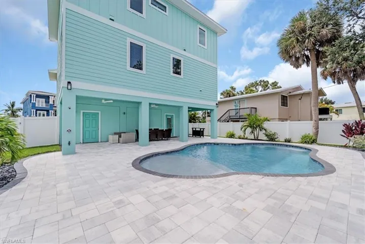 View of swimming pool with a patio area