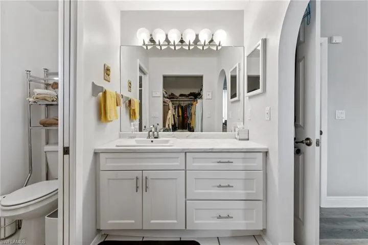 Bathroom featuring vanity and toilet