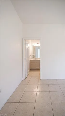 Hall with light tile patterned floors