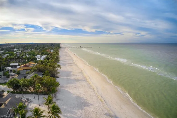 Bird's eye view with a view of the beach and a water view
