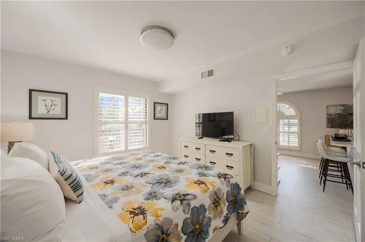 Bedroom featuring multiple windows