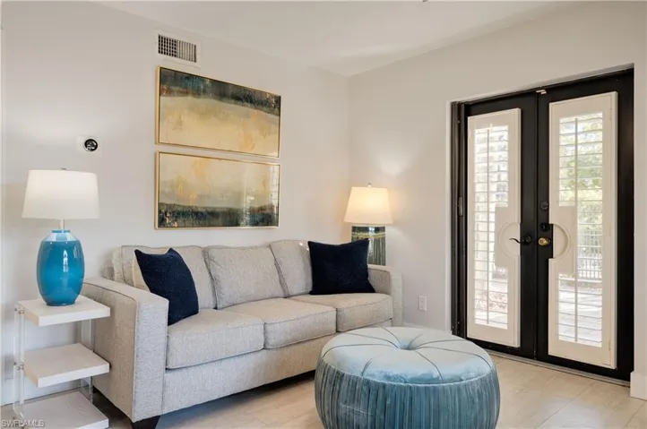 Living room featuring french doors and light hardwood / wood-style floors
