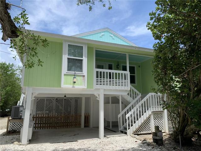 Stilt construction with a metal roof, impact glass windows and sliding doors, and storms shutters. Interior living area not flooded during Hurricane Ian.