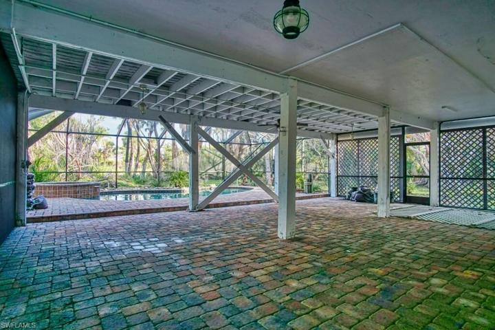 Very spacious ground level area ideal for poolside games, covered lounging, grilling, extra storage, or additional parking if required.