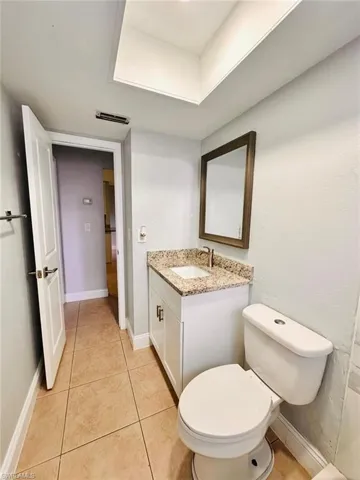 Bathroom with vanity and light tile patterned flooring