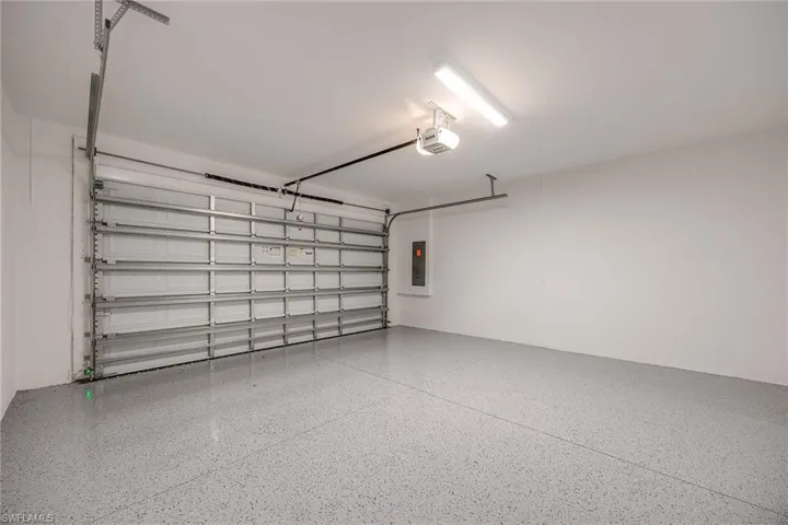 Large 2 car garage with epoxy flooring.