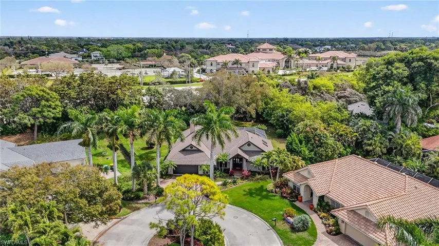 Aerial view of residential area with a tree filled landscape