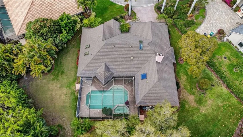 Aerial view of property and surrounding area with a pool