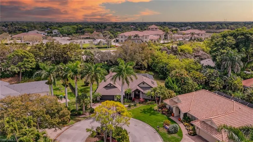 Aerial perspective of suburban area with a tree filled landscape
