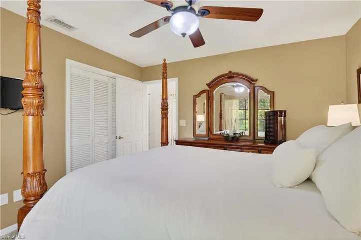 Bedroom featuring ceiling fan and a closet