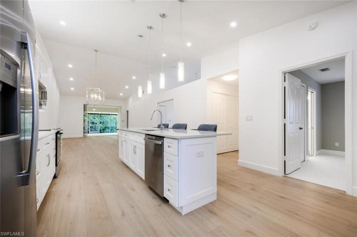 Open Concept Kitchen/Dining/Great Room with Pocket Sliders to the Large Lanai