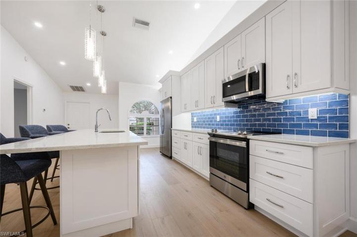 GE Appliance Package and Beautiful Subway Tile Backsplash