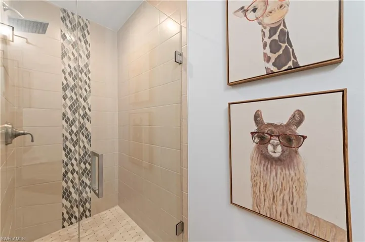 Bathroom with a shower with shower door