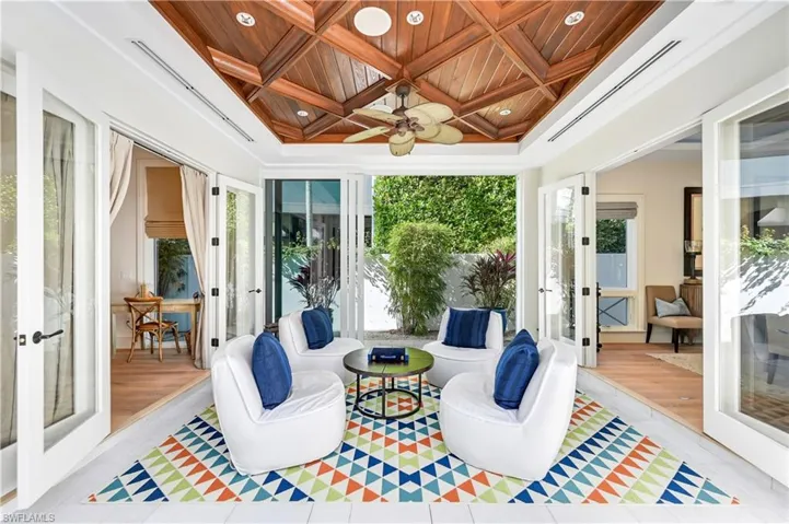 Sunroom with french doors, wooden ceiling, coffered ceiling, and recessed lighting