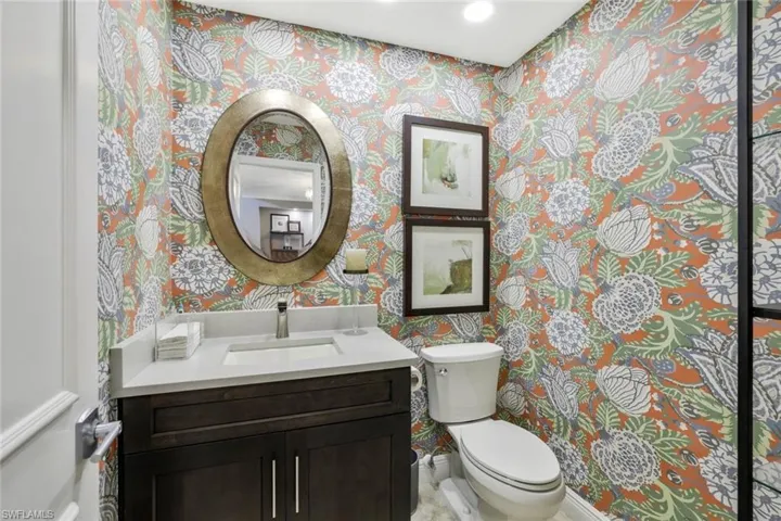 First Floor Powder Bath Located Down a Small Hallway, Cambria Quartz, Raised Cabinetry