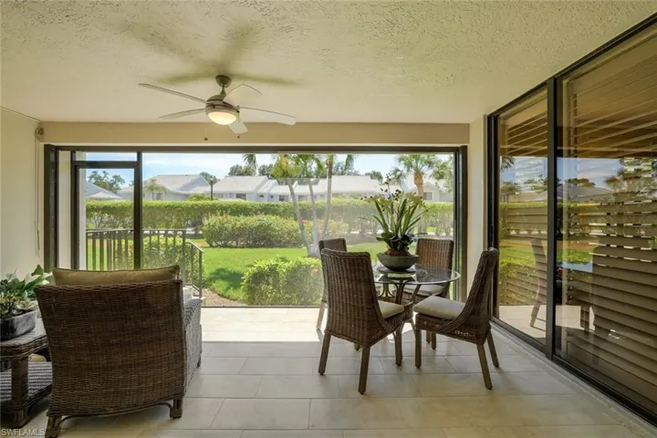 Tiled Picture Window Lanai w/Bug Screen, Motorized Storm Smart Hurricane Shutters