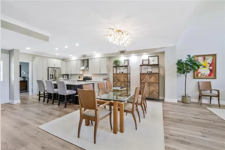 Wide View of Dining Area and Unique Kitchen- Wide Plank Vinyl Flooring Throughout Main Areas