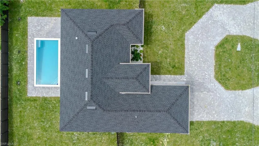 View of subject property featuring a pool