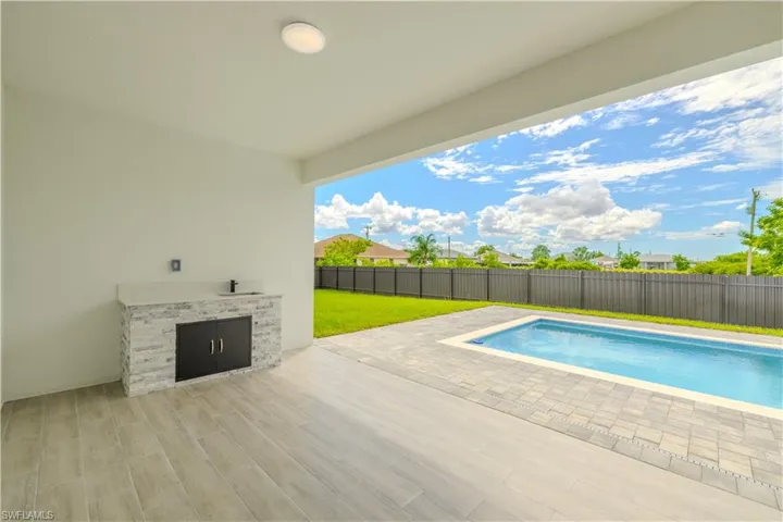 View of pool featuring a patio area and a fenced backyard
