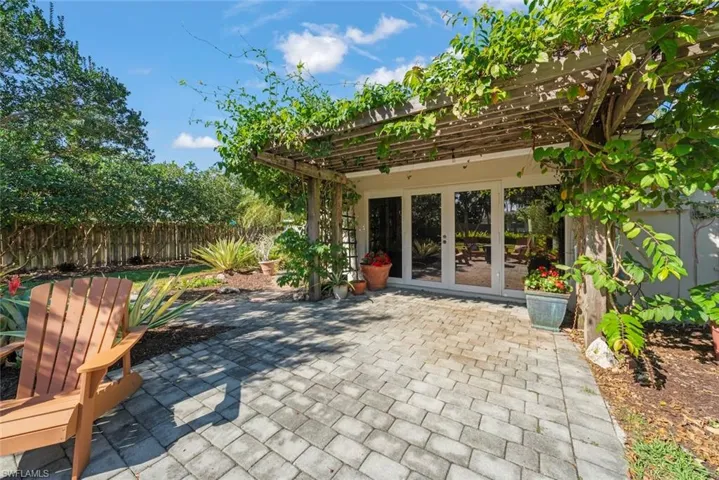 Patio with french doors and a pergola