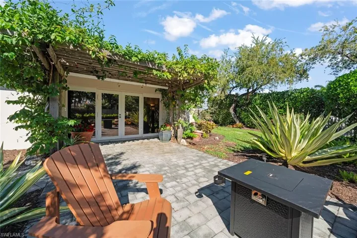 Patio with french doors and a pergola