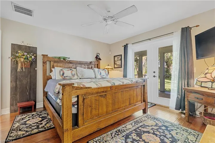 Spacious Guest Bedroom with French Door Access to the Lanai and Pool