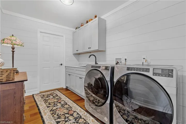 Super large and fancy laundry room with lots of storage.