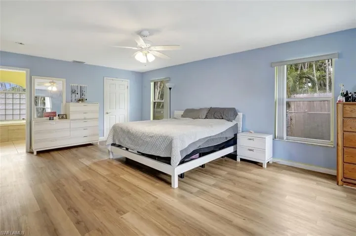 Bedroom featuring light hardwood / wood-style floors and ceiling fan
