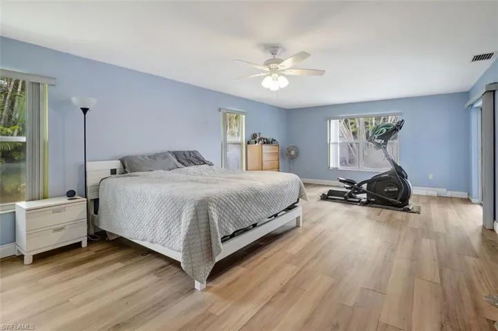 Bedroom featuring ceiling fan and light wood-type flooring