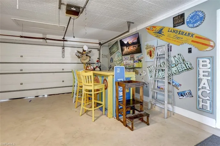 Garage featuring a garage door opener