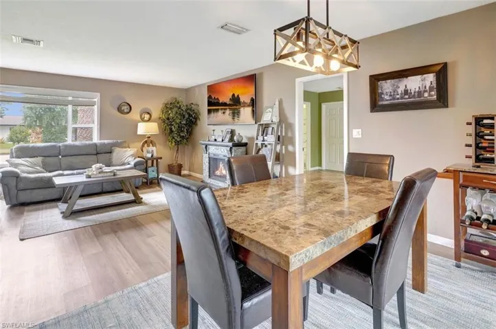 Dining room featuring light hardwood / wood-style floors and a chandelier