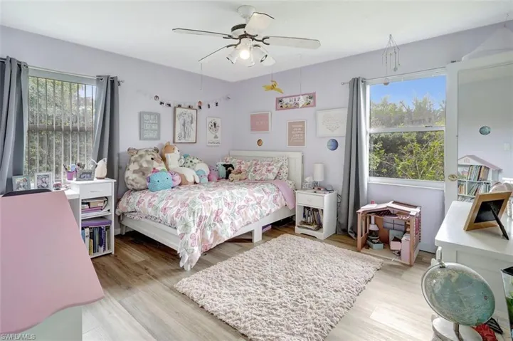 Bedroom featuring ceiling fan and light wood-type flooring