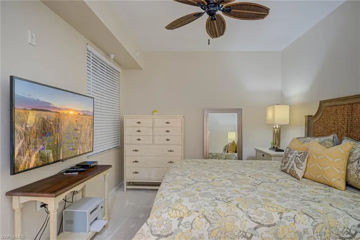 Bedroom featuring baseboards and ceiling fan
