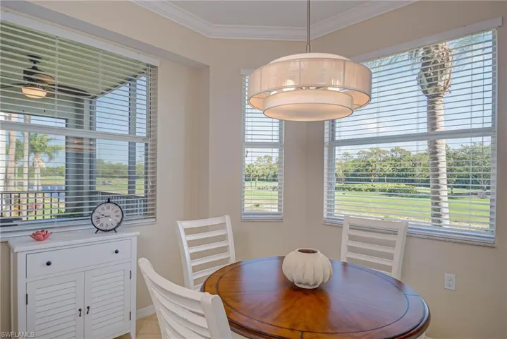 Dining room featuring crown molding and baseboards