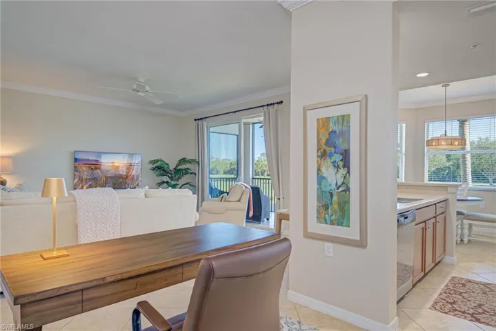 Office featuring a ceiling fan, visible vents, ornamental molding, and light tile patterned floors