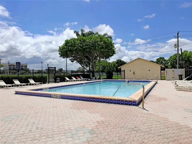 Community pool with a patio area