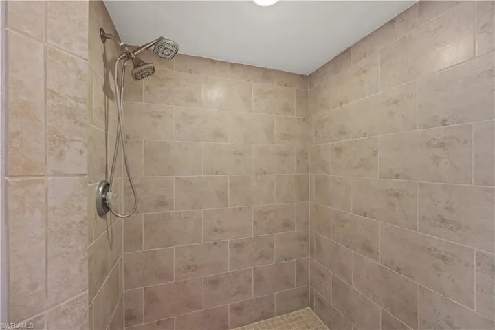 Bathroom featuring a tile shower