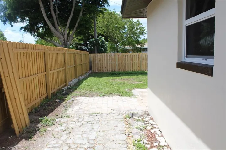 Fenced backyard with a patio area
