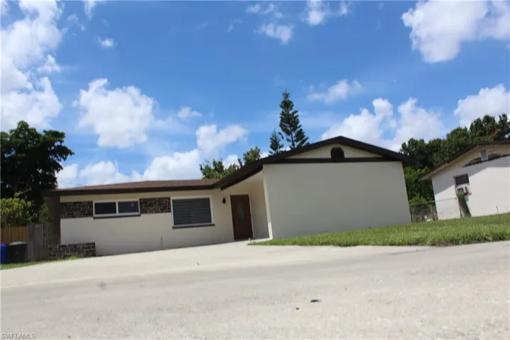 Ranch-style home featuring stucco siding