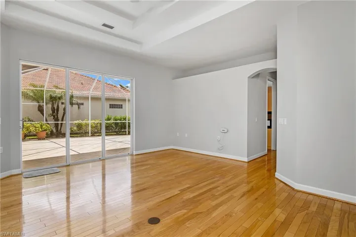 View of family room leading to outdoor courtyard.