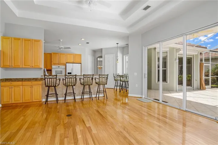 Open family room and kitchen with large island and kitchen cafe, overlooking the outdoor courtyard.