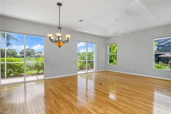 Entertain guests in this open dining/living space featuring two sets of sliders leading to an additional lanai patio with water views.