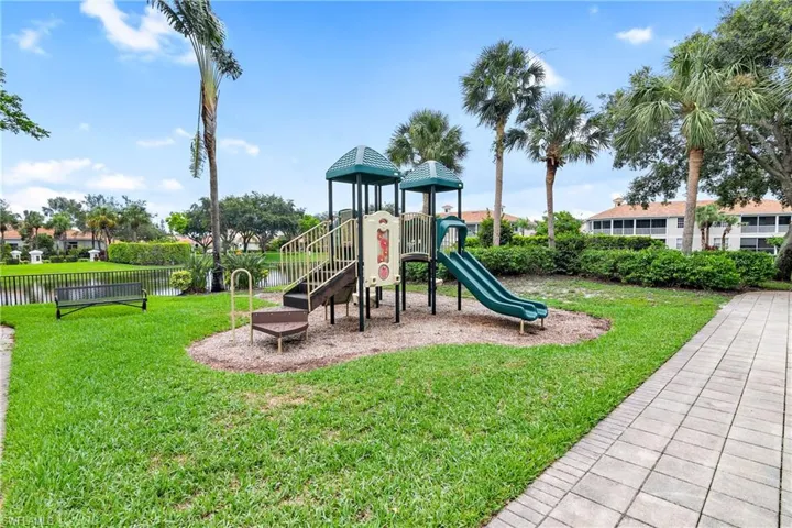 View of playground with a yard