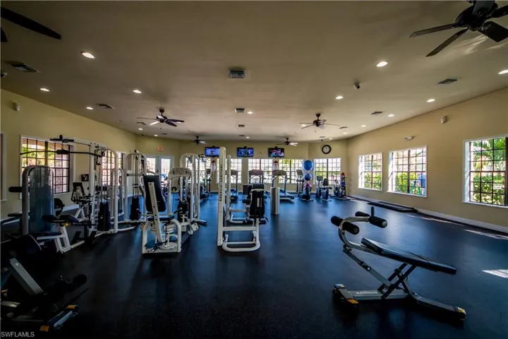 Workout area with recessed lighting and ceiling fan