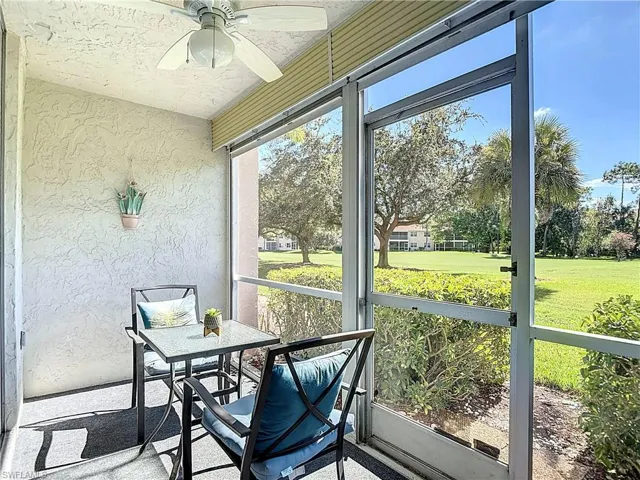 Sunroom featuring ceiling fan