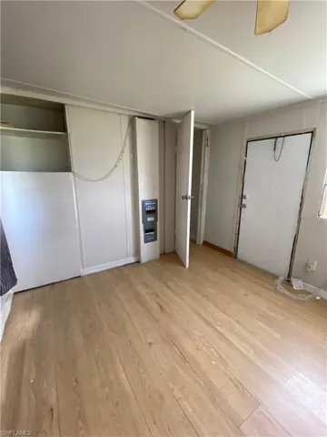 Unfurnished bedroom with light wood-type flooring