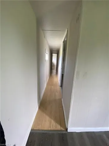 Hallway with wood-type flooring